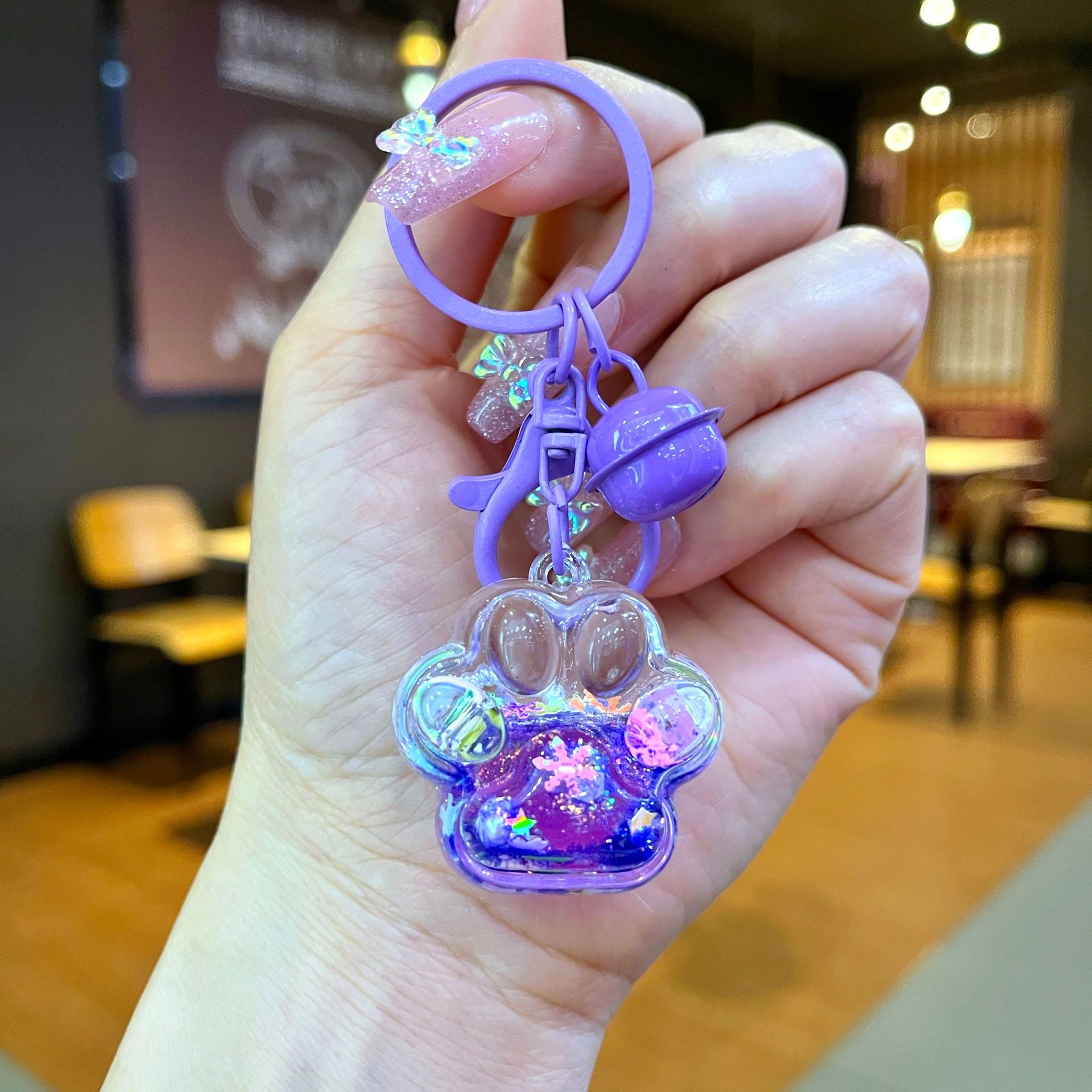 Aceite de gato garra arenas movedizas llavero lindo dibujos animados cadena colgante captura muñeca máquina agarrar pequeño regalo al por mayor