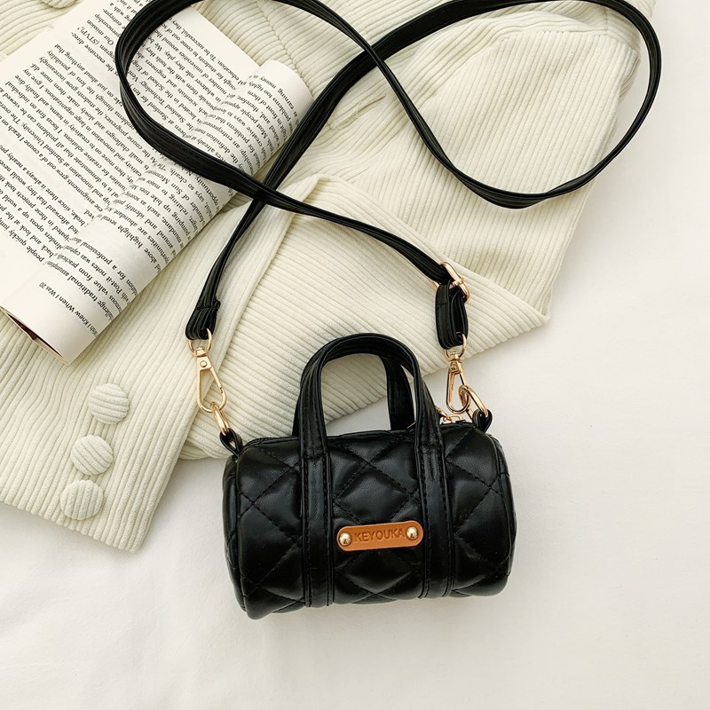 Bolsas infantiles simples de color sólido, bolsas de mini barril de moda coreana, 2025 nuevas bolsas para bebés de comercio exterior