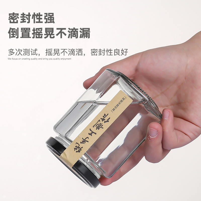 Hexagonal de vidrio enlatado sellado de grado alimenticio con tapa vacía un kilo de pasta de limón, miel, pimienta, botella de mermelada