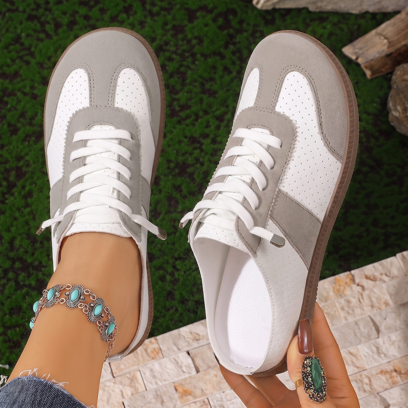 Zapatos de verano transfronterizos de mujer agujero de ventilación de la cabeza de lazo medio arrastrado de color con base suave zapatos perezosos de estilo de viaje ocio