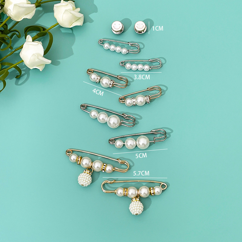 Flores jeans de cintura, pantalones de artefacto, aguja de botón más pequeña, cintura apretada, aguja de cintura ajustable