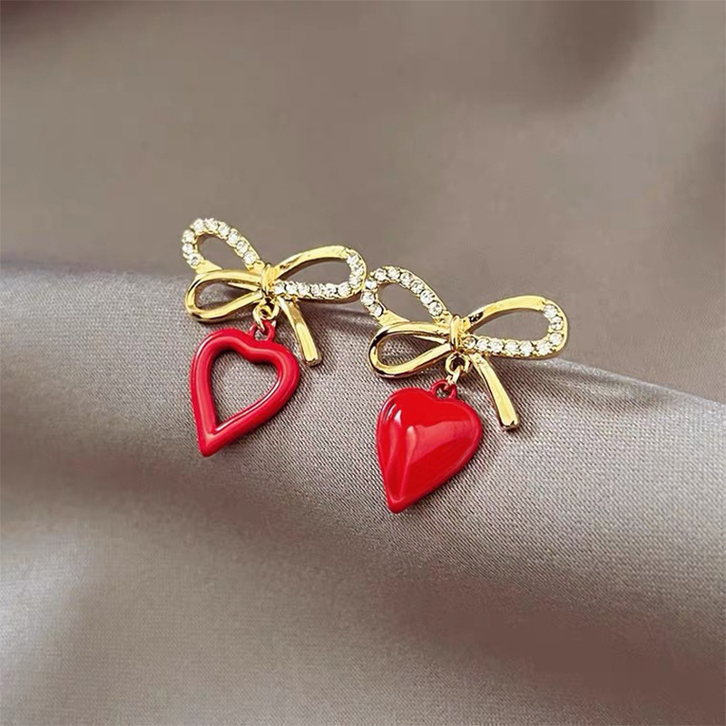 Korean Style Heart Shaped Hollowed Bows Alloy Stud Earrings Wholesale display picture 2