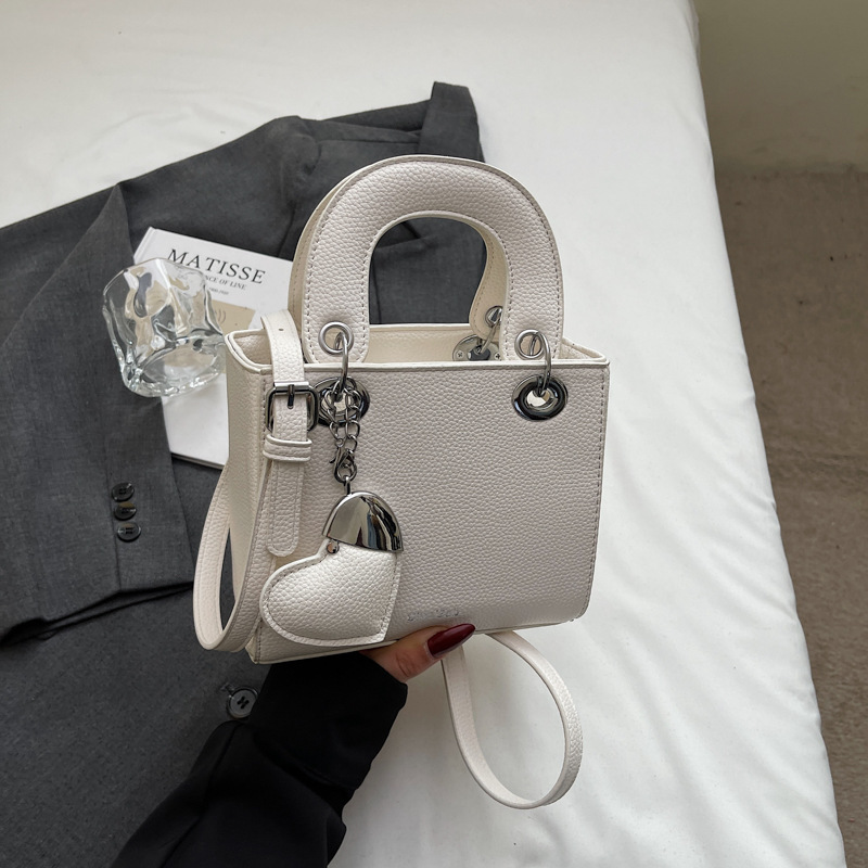 Bolso de mano de alta gama de comercio exterior para mujer 2025 nuevo bolso de hombro de todo fósforo de nicho de estilo occidental bolso de mensajero de moda