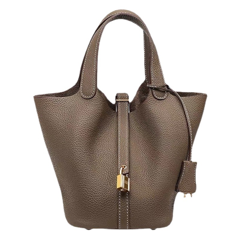 2022 nuevo color a juego bolsa de cesta de verduras bolso de cubo de piel de vaca patrón de Litchi primera capa de piel de vaca simple bolso portátil de mujer