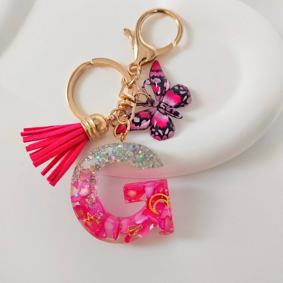 Inventario transfronterizo nueva resina bicolor mariposa borda llavero colgante estrella luna accesorios de joyas