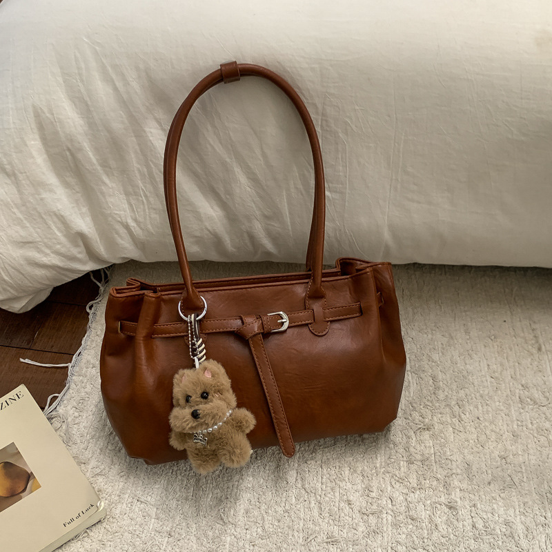 Otoño y invierno bolsas de mano de viaje de mujer bolsas retro de gran capacidad 2025 nuevas bolsas de hombro y brazales casuales versátiles
