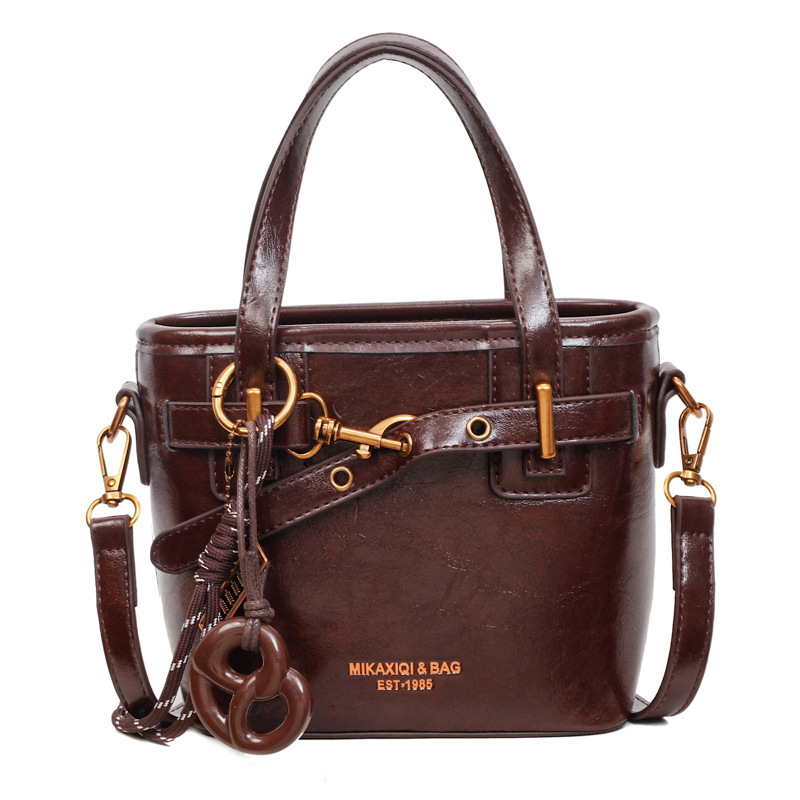 Coreano de alta calidad elegante bolso de cubo portátil para mujeres 2025 nuevo retro versátil viaje mochila de hombro