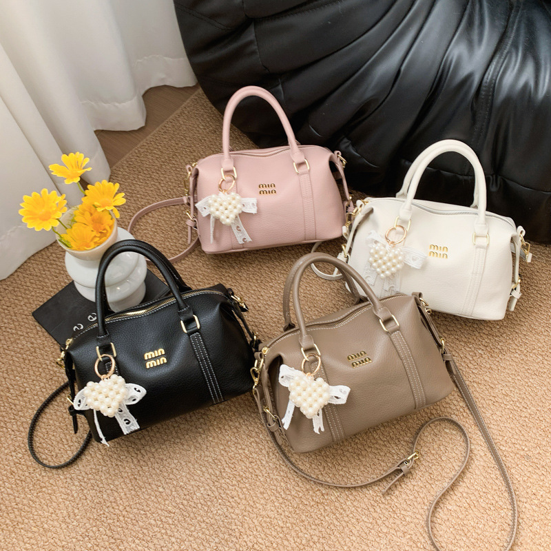 2026 nuevo bolso de bolos de mano de mujer simple sensación cotidiana de nicho de viaje coreano bolso de mujer bolso de almohada
