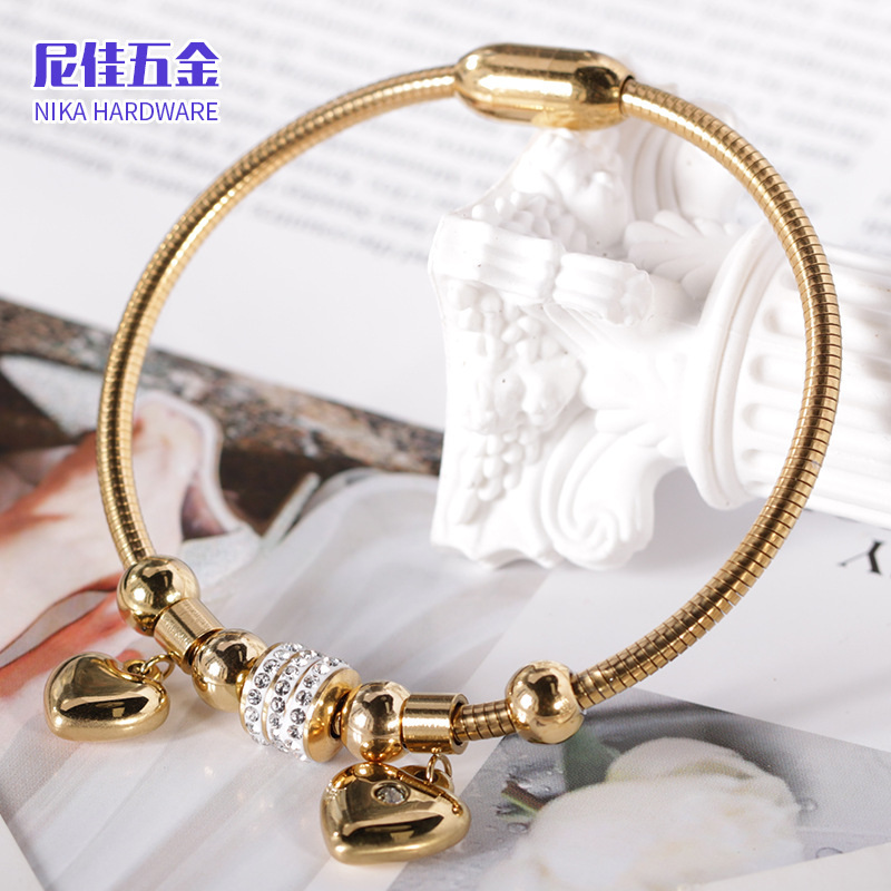 Pulsera magnética de acero de titanio con corazón de melocotón, diseño de lujo ligero y brillo elegante