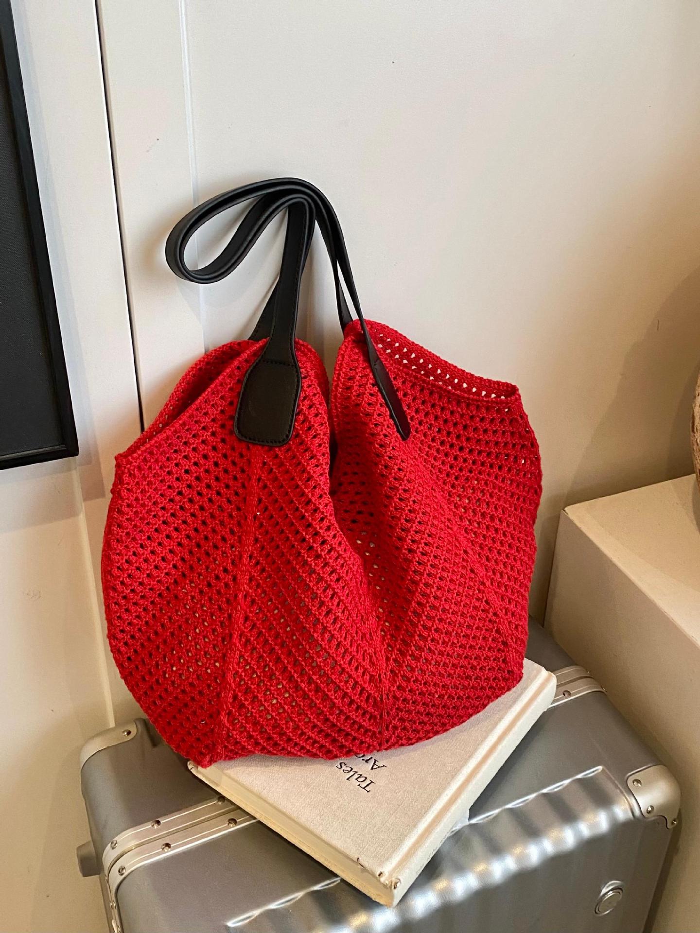 Bolso Tote de gran capacidad hueco tejido femenino 2025 nuevo bolso de playa de vacaciones junto al mar bolso tejido de paja de alta gama coreano