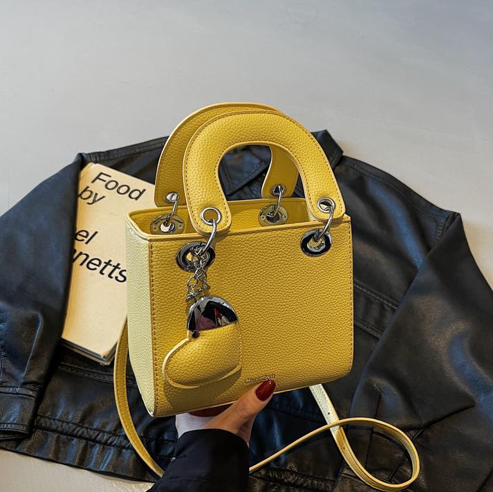 Bolso de mano de alta gama de comercio exterior para mujer 2025 nuevo bolso de hombro de todo fósforo de nicho de estilo occidental bolso de mensajero de moda