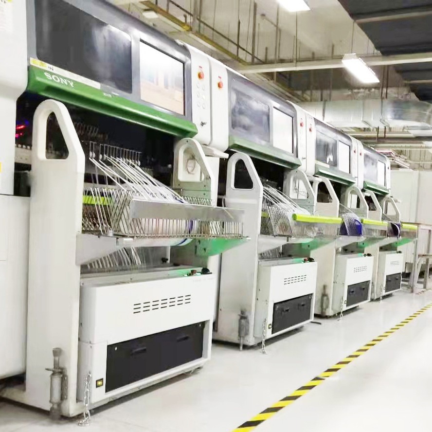 Sony mounter line with scrap tape cutters installed under each feeder cart