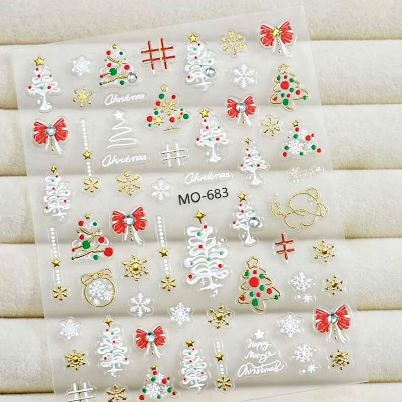 Christmas Themed Nail Stickers with Christmas Tree, Bow, and Snowflake Designs. Holiday Adhesive Nail Stickers Suitable for Children Christmas Themed Nail Stickers with Christmas Tree, Bow, and Snowflake Designs. Holiday Adhesive Nail Stickers Suitable for Children