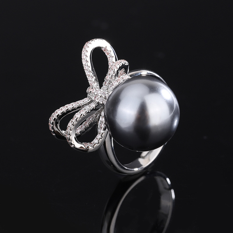 Zhuang Sheng joyería cobre inferior chapado en oro nuevo gris con incrustaciones rebordear moda arco diamante traje femenino 14mm