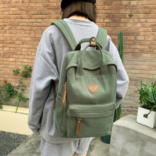 帆布双肩包女秋季新款休闲旅行手提包韩版简约质感初高大学生书包