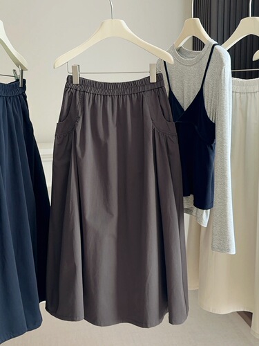 2026 spring and autumn new style elastic waist loose pocket skirt for women with high waist a-line skirt large swing medium and long umbrella skirt