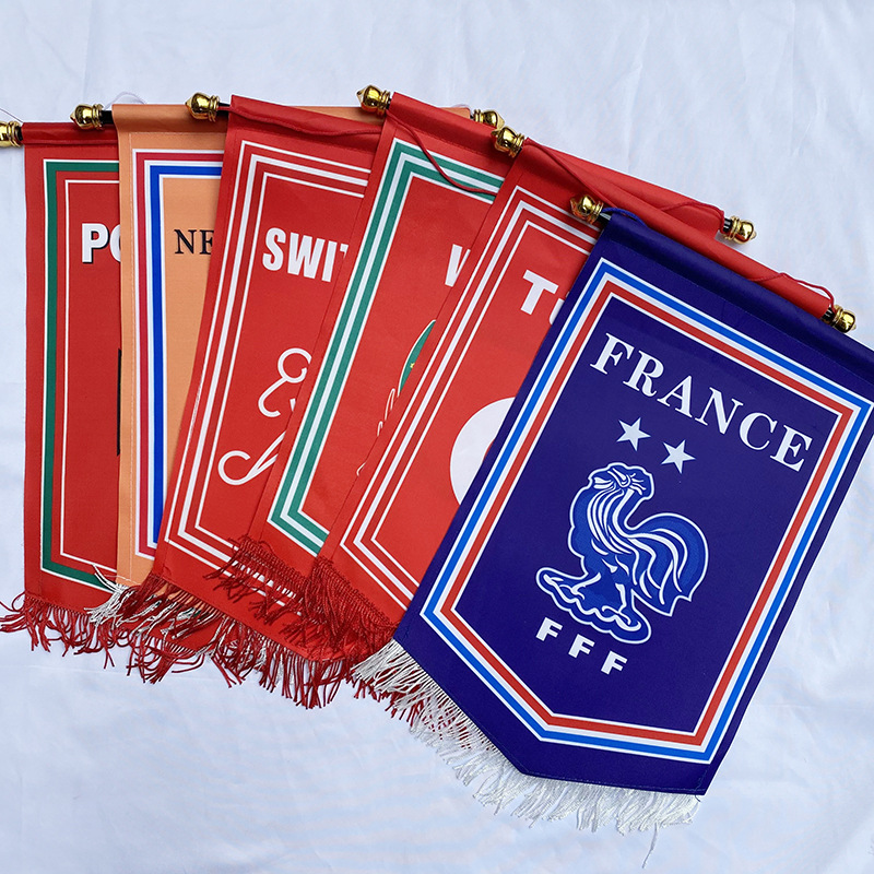 Decorate the World Cup with 32-team flag ribbons: Brazil, Argentina, France, Netherlands, Uruguay, and Germany flags.