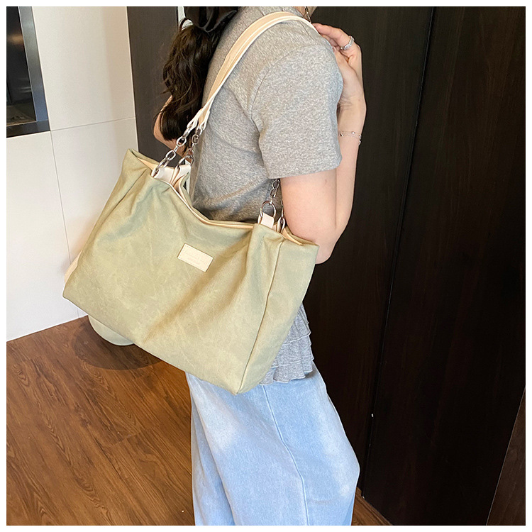 Korean style simple and versatile bag for women, new summer 2025 fashion and niche handbag, large capacity tote bag for commuting undefined