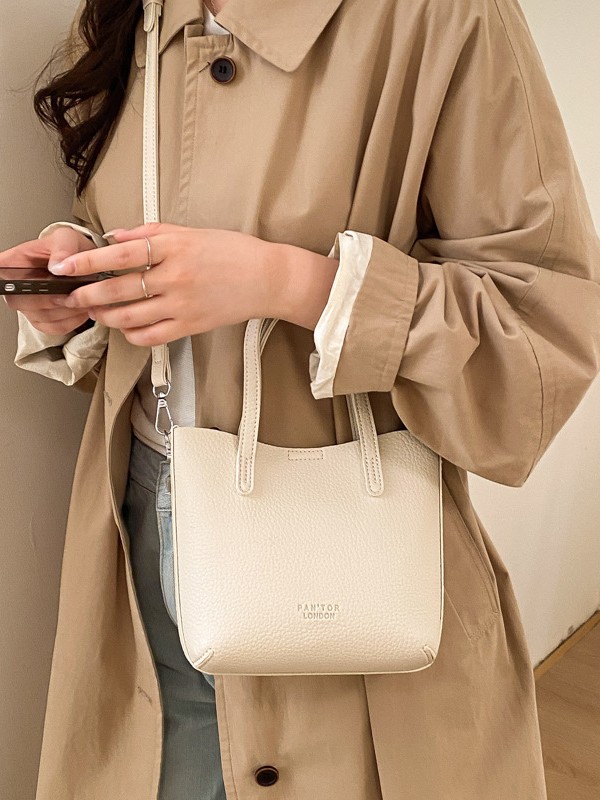 2026 nueva moda de un hombro mochila retro gran capacidad ligera de lujo simple viaje bolsa de cubo de textura bolsa madre