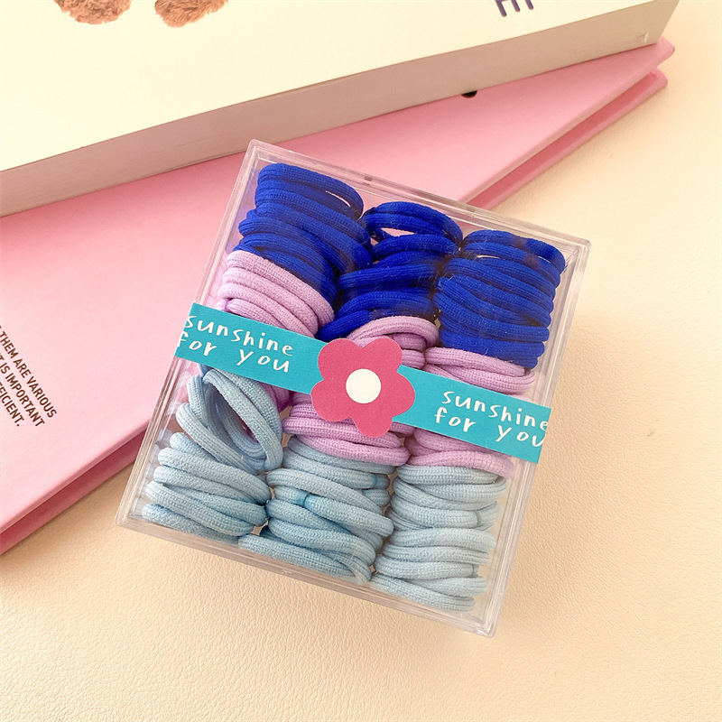 Base de banda de pelo pulgar de los niños base 90 bandas de goma cuerda de pelo para niños color caja de pelo cuerda cabeza accesorios al por mayor