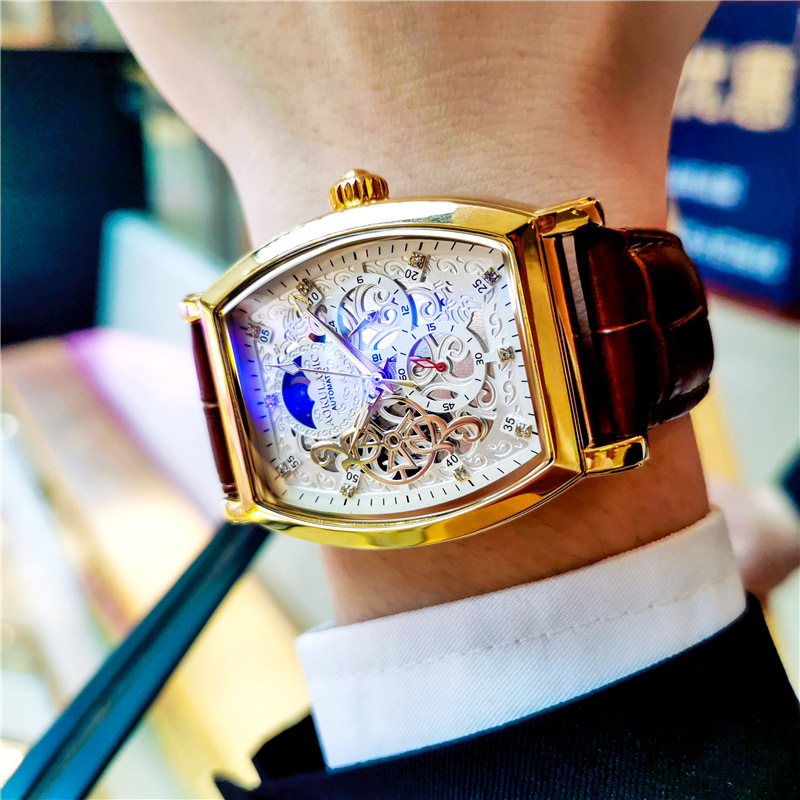 Barril de vino Reloj mecánico automático hueco-hacia fuera transparente azul claro vidrio luminoso de cuero impermeable de los hombres hebilla de mariposa Mesa multifunción