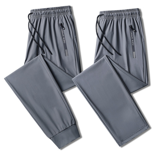 Summer couple ice silk trousers for men and women sports running quick-drying trousers warp knitted stretch large size trousers with printed LOGO