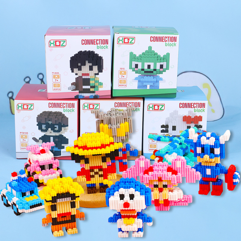 Pequeños bloques de construcción de partículas para niños, juguetes de ensamblaje de rompecabezas de muñecas, dibujos animados, dibujos animados, rompecabezas, bloques de ensamblaje, caja ciega