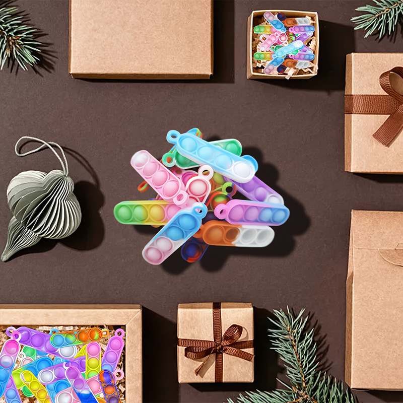 Nuevo mini pionero de rodadura llavero de silicona redondo largo colgante de burbuja Fidget juguetes de descompresión para niños