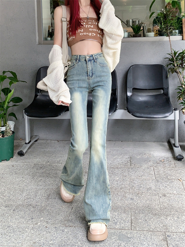 ギャルはやせているジーパンの女性の夏の新型の小さい大衆のズボンの小さいラッパのズボンのストレートなズボンの地面を引きずって明るい色のズボン|undefined