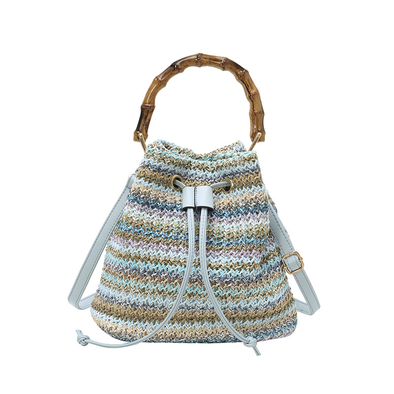 Bolso de cubo de vacaciones junto al mar 2025 nuevo bolso de bambú bolso de hombro de color de contraste tejido de paja bolso de mensajero para mujer de playa