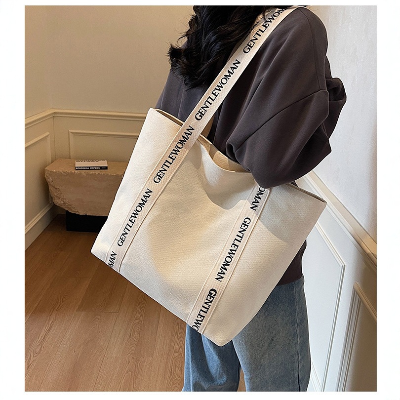 大容量单肩包包女泰国潮牌字母帆布包时尚休闲手提百搭通勤托特包
