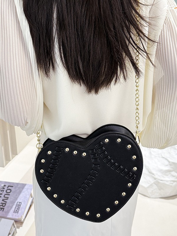 Bolso de mujer verano nuevo bolso en forma de corazón nicho coreano diseño de moda trenzado remaches cadena mochila de hombro