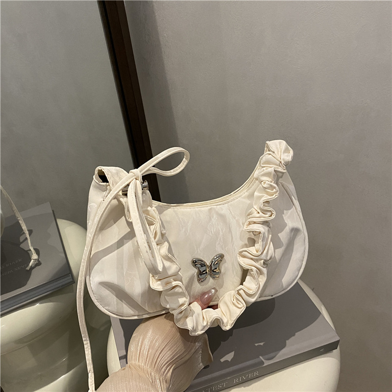 Borsa a tracolla singola alla moda invernale 2025 con decorazione a farfalla, ideale per spostamenti quotidiani._voghion.com