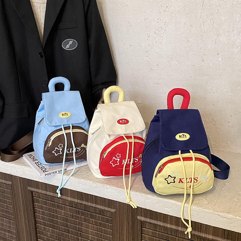 Jardín de infantes bolsas escolares de estudiantes de clase media y grande, pequeñas estrellas de dibujos animados, mochila infantil encantadora, viajes, mochila pequeña.