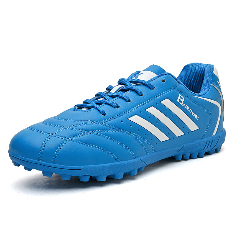 Zapatos de fútbol en stock, zapatos de entrenamiento anti-deslizante para niños, respirados y amortiguados, zapatos de entrenamiento juvenil