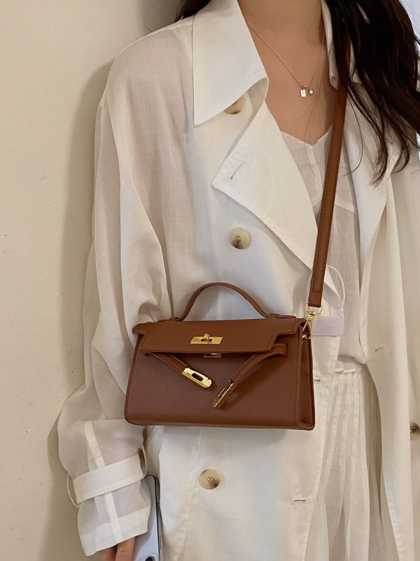 La sensación de alta calidad de la bolsa portátil Kelly 2026 nuevo estilo de lichi estampado moda ligero lujoso ocio mochila de hombro