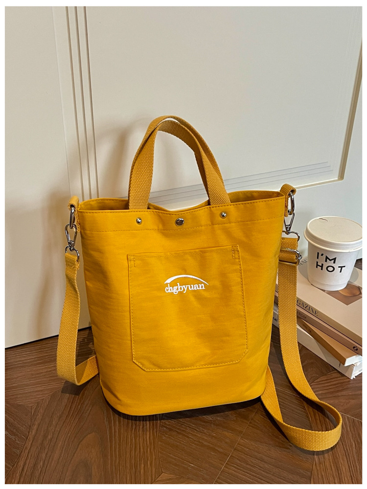 Bolso de mano de gran capacidad para mujeres 2026 verano nuevo estilo coreano simple mochila de hombro de viaje bolsa de ocio