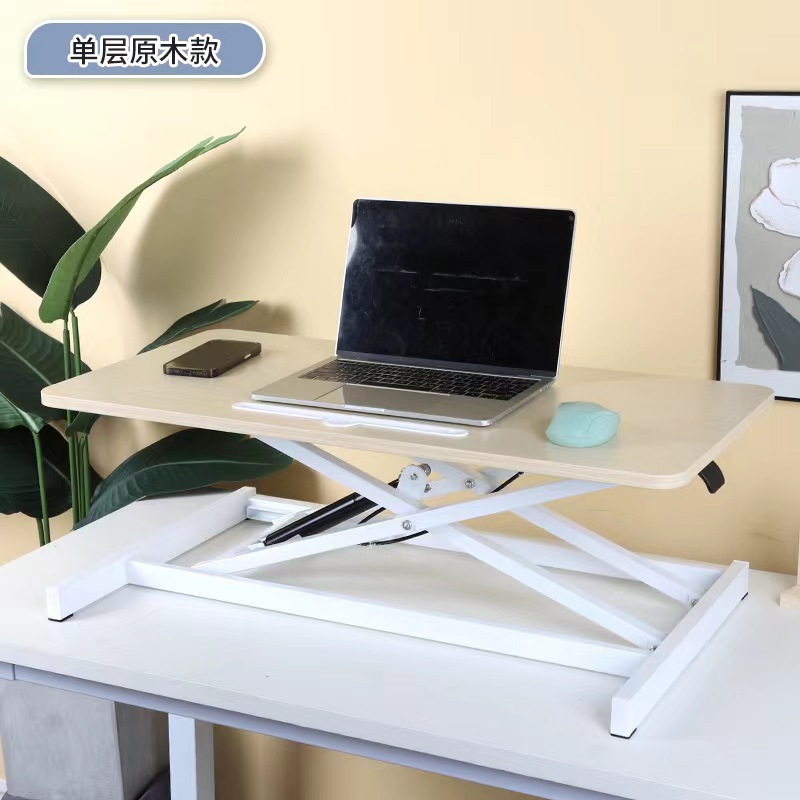 気動机の上のコンピュータの机は立式の事務室の台の上に立って高くなるノートの折り畳みの机で机を昇降することができます。
