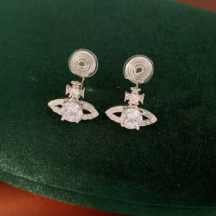 Zircon Saturno hueco orejas de orejas mujeres sin agujeros de orejas de aire frío personalidad pendientes ligeros de lujo alta sensación de auriculares al por mayor