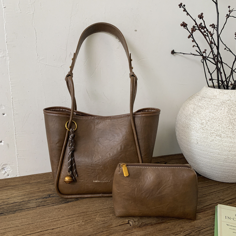 Bolso de mujer venta caliente nuevo nicho coreano bolso de cubo de alta capacidad de sensación universal bolso de moda para niños bolso de hombro