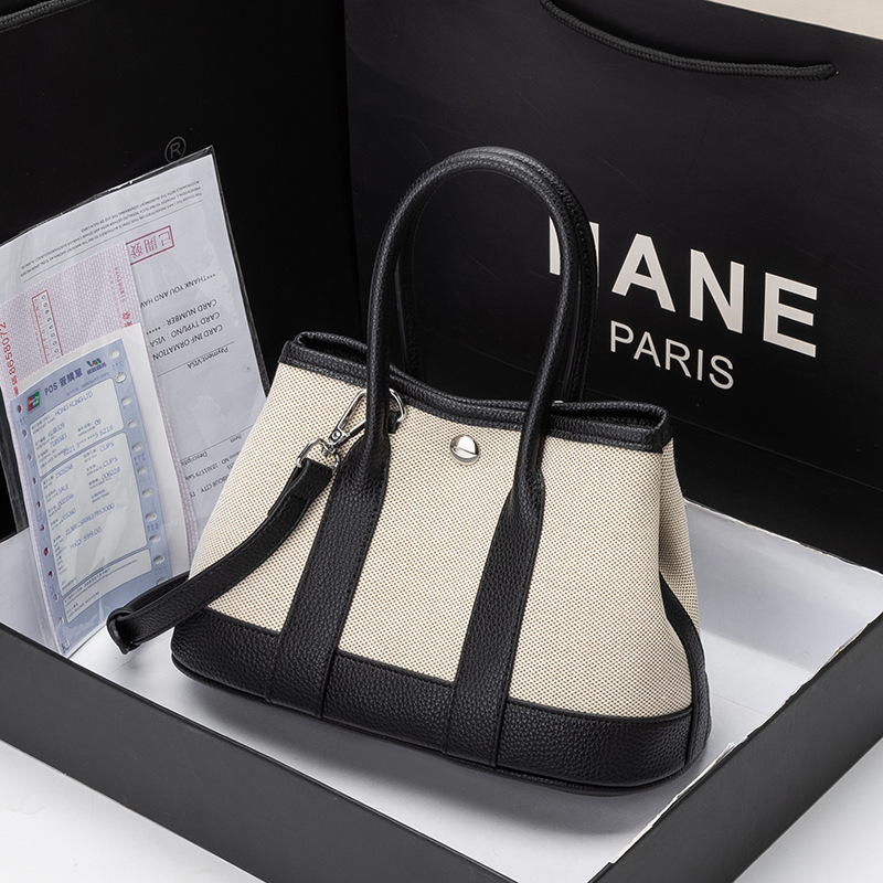 Niche High-End Style 2026 New Model Women's Genuine Leather Handbag Large Capacity Canvas Color-Blocking Patchwork Garden Tote Bag Niche High-End Style 2026 New Model Women's Genuine Leather Handbag Large Capacity Canvas Color-Blocking Patchwork Garden Tote Bag