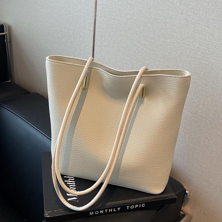 Bolso de viaje de moda simple para mujeres 2024 nuevo retro versátil bolso de hombro de nicho de alto nivel bolso de cubo