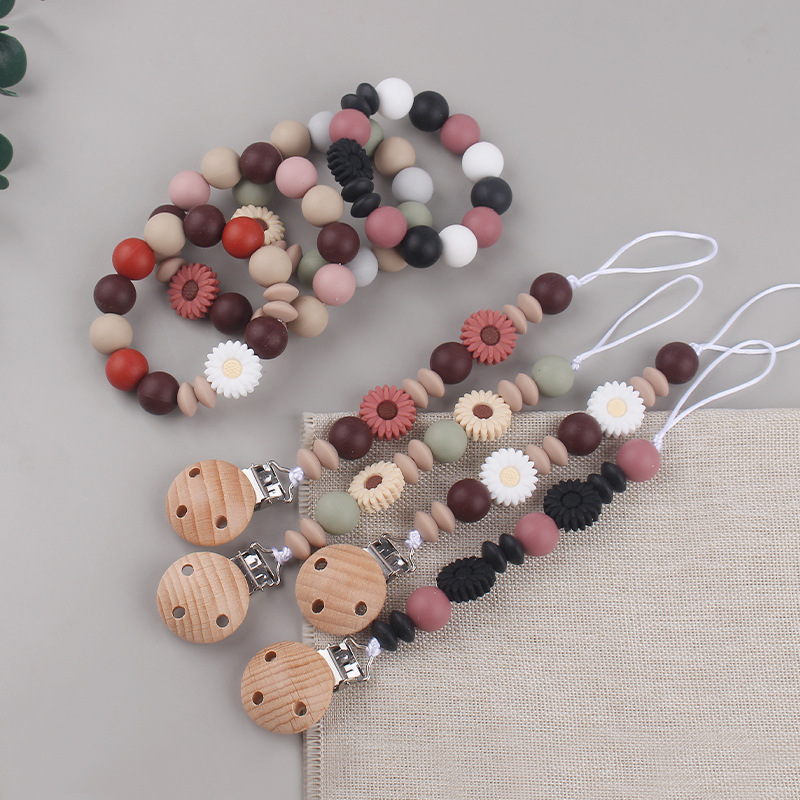 Nueva margarita pequeña cadena de tetina para calmar a los bebés anti-caída cadena creativa DIY pulsera de goma de diente dos conjuntos