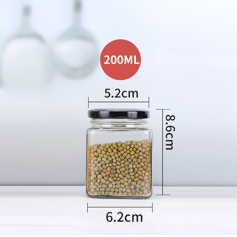 Suministro de botella de vidrio de cuatro bordes sellada transparente cuadrado multi-grano botella de almacenamiento puede botella de miel sub-botella al por mayor