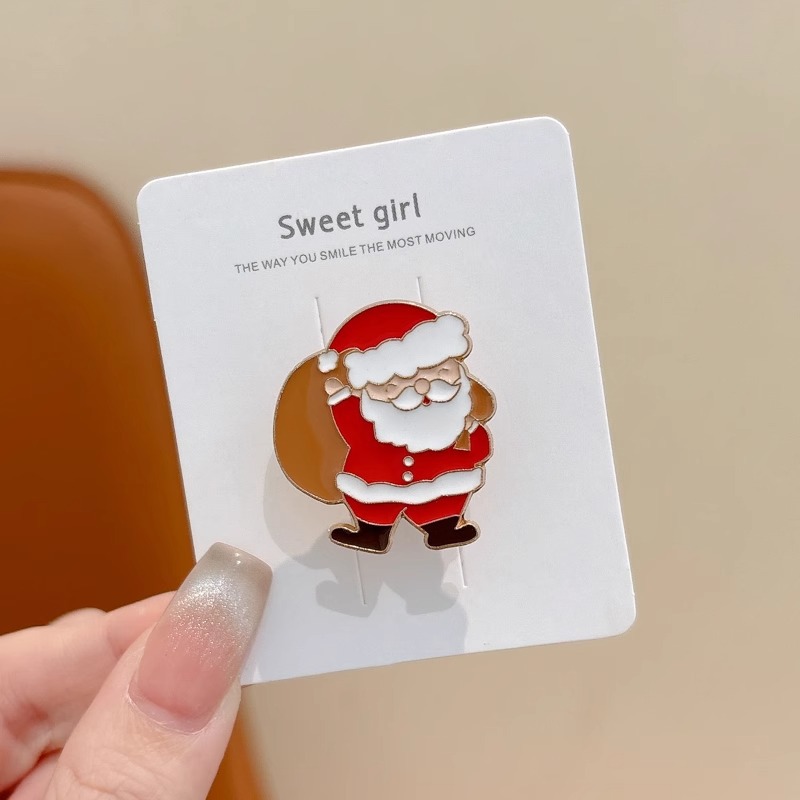 Broche de aleación de sentido avanzado japonés nueva insignia de personalidad de moda femenina de dibujos animados bolsa de Navidad accesorios de metal al por mayor