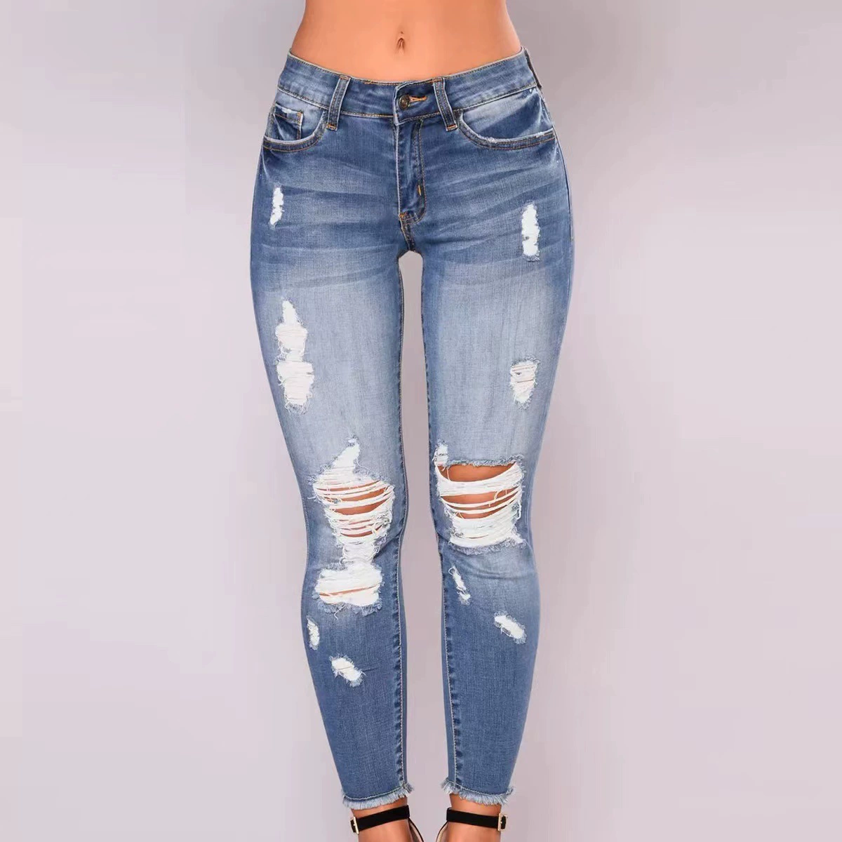 Европейская и американская трансграничная внешняя торговля происхождения Xintang весенне-летние эластичные рваные тонкие джинсовые женские брюки с высокой талией