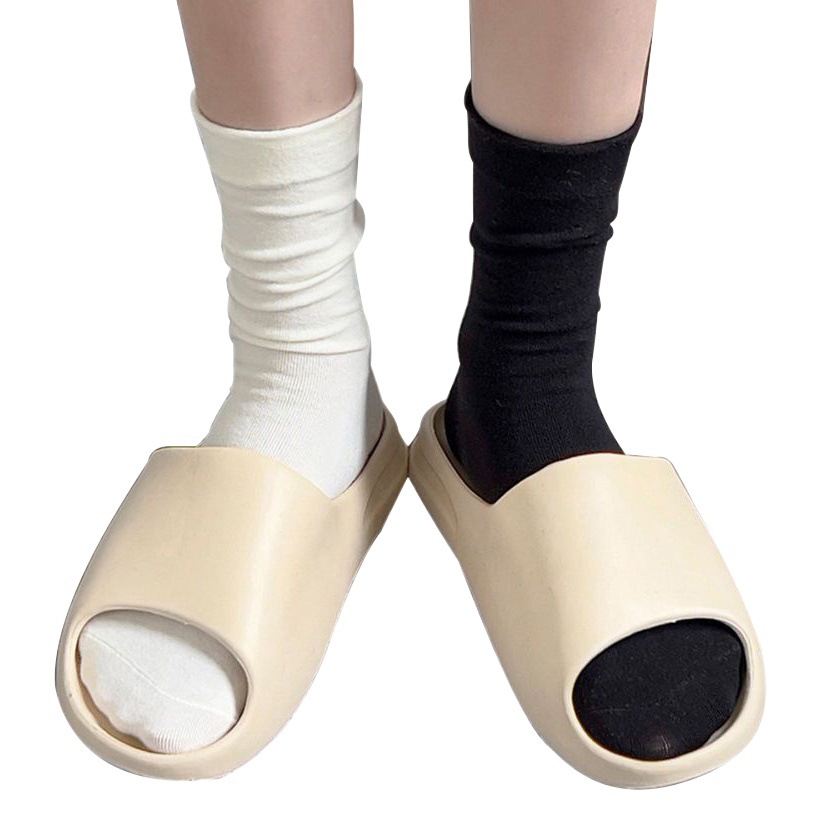 Calcetines Zhuji calcetines femeninos cómodos Otoño e Invierno cilindro blanco y negro color sólido sin hueso Calcetines fábrica calcetines al por mayor