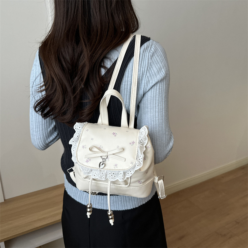 Mochila de flores para mujeres 2026 nueva moda alta sensación de mochila de estilo universitario ultra caliente de moda versátil mochila de viaje