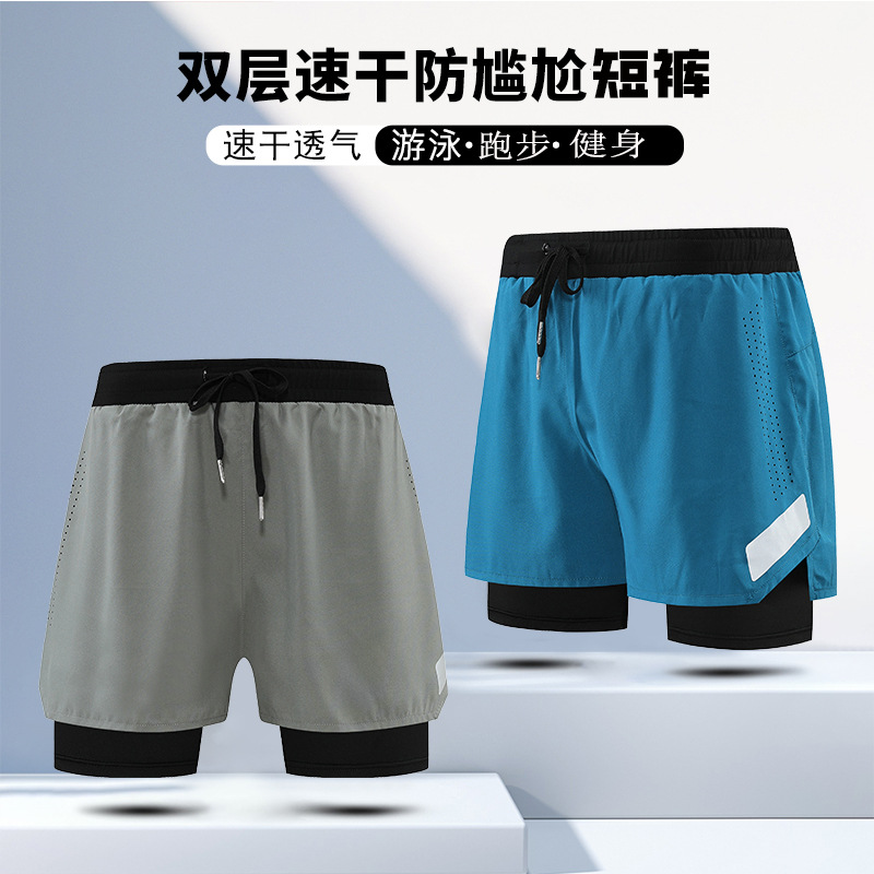 Pantalones cortos deportivos falsos de dos piezas de doble capa de secado rápido transpirable anti-exposición entrenamiento para correr pantalones de tres puntos pantalones cortos de fitness Comercio exterior hombres