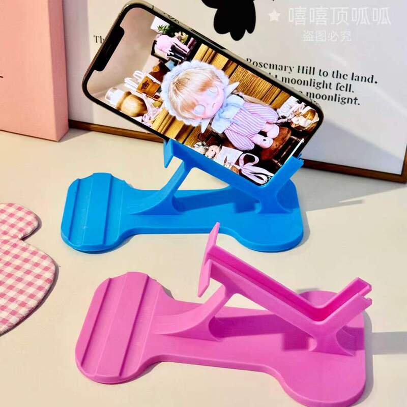 Artificially Designed Side-Lying Phone Holder, a Gadget for Using Your Phone While Lying on Your Side, Tablet Stand, Horizontal Streaming and Reading Gadget Artificially Designed Side-Lying Phone Holder, a Gadget for Using Your Phone While Lying on Your Side, Tablet Stand, Horizontal Streaming and Reading Gadget